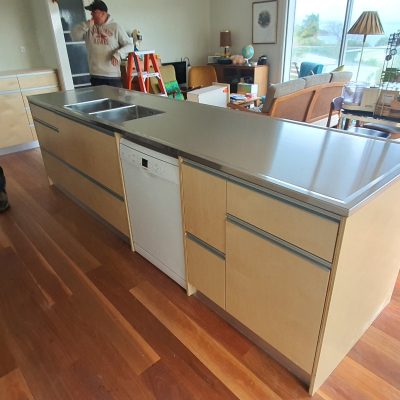 Birch plywood kitchen with stainless steel counter top